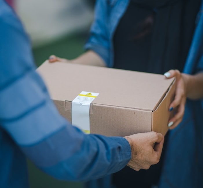 A parcel being handed to a customer